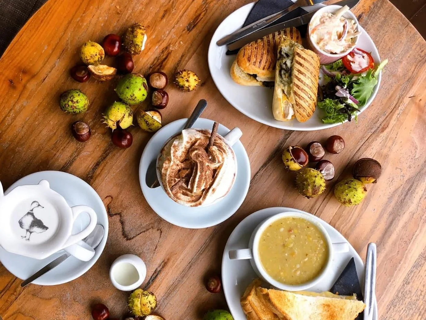 Coffee, soup and lunch dishes arranged on a table at Coffee Bank